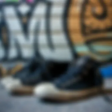 Artistic Display of Chuck Taylors with Graffiti An artistic display of black Chuck Taylors against a graffiti backdrop