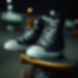 A pair of black monochrome Chuck Taylors resting on a skateboard