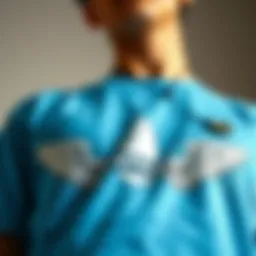 Close-up of a Carolina blue graphic tee showcasing unique design elements
