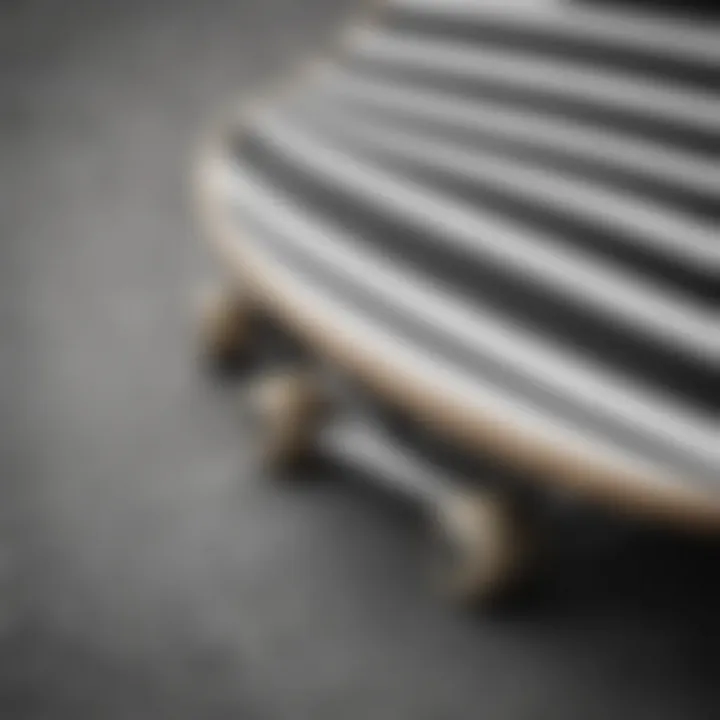 Close-up shot of a black and white striped t-shirt on a skateboard.