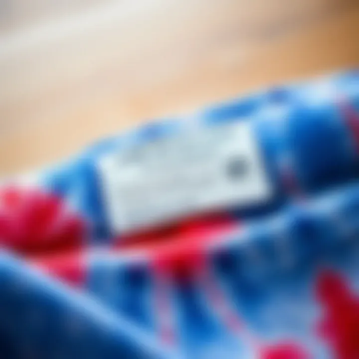 Care instructions for blue tie-dye sweat pants illustrated on a label