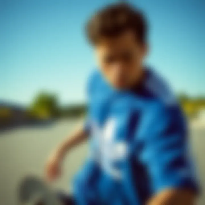 Skater wearing the Adidas blue shirt during an outdoor skate session