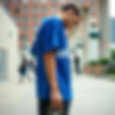 Adidas blue shirt showcased in an urban skate setting