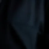 A close-up view of the black tech jacket's fabric showcasing its durability and texture.