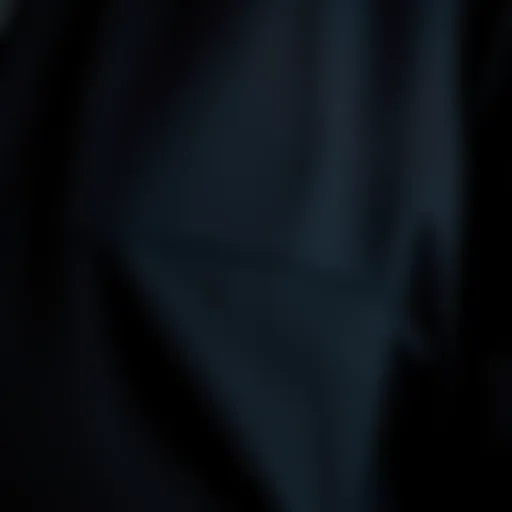 A close-up view of the black tech jacket's fabric showcasing its durability and texture.