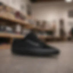 A stylish pair of black Vans displayed on a skateboard in a retail setting