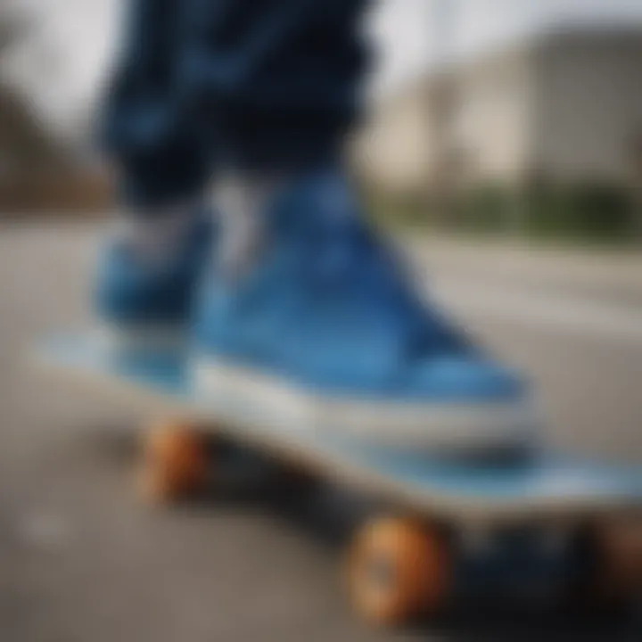 Close-up of blue Adidas shoes on a skateboard