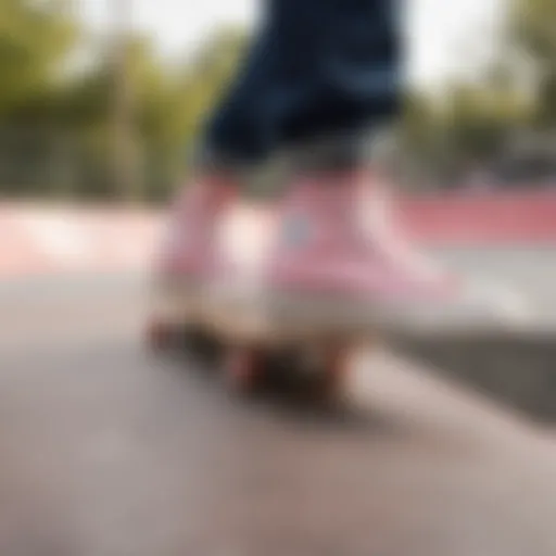 Blush pink Converse against a vibrant skatepark backdrop