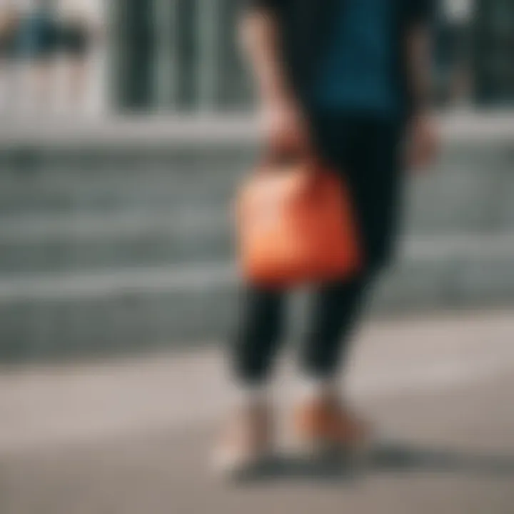 Person using Herschel Supply lunch bag in daily life