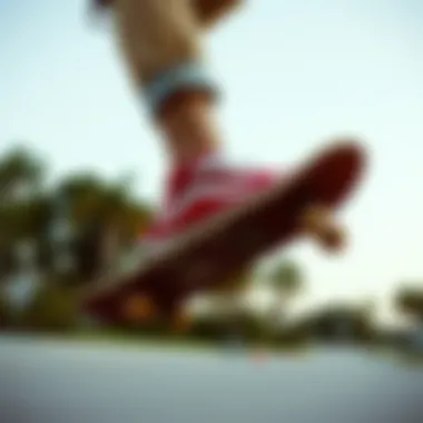 Skateboarder wearing red Old Skool Vans in action