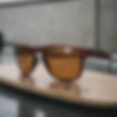 Stylish Oakley sunglasses laid on a skateboard deck