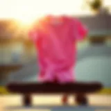 Stylish RVCA pink shirt displayed on a skateboard