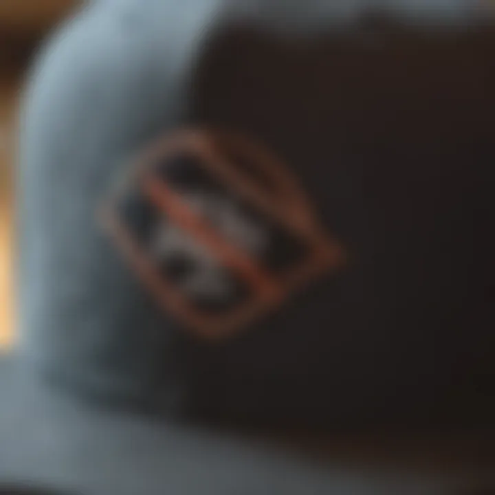 Close-up view of a curved bill snapback hat showcasing intricate stitching.