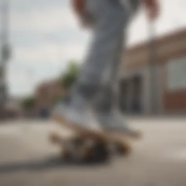 Skateboarder performing a trick while wearing adidas Busenitz Grey Gum sneakers