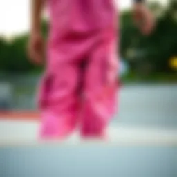 Close-up of pink cargo pants showcasing design details