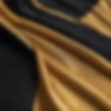 Close-up of the fabric texture of a gold and black hoodie