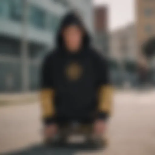 A stylish gold and black hoodie displayed on a skateboard