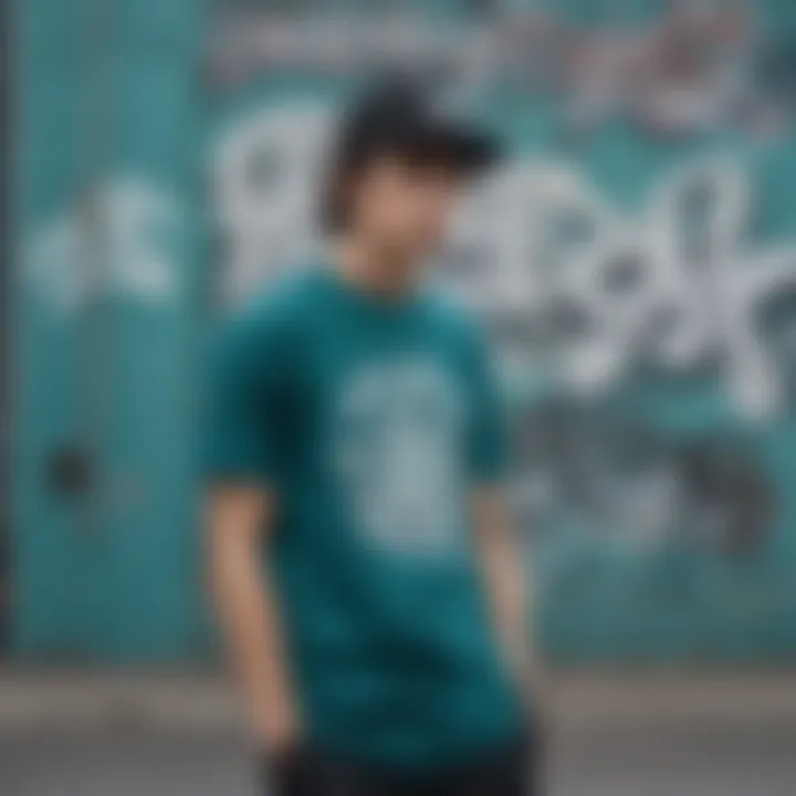 Dark teal t-shirt displayed against an urban graffiti backdrop