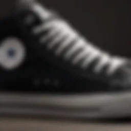 Close-up view of the Converse Chuck Taylor Classic Black showcasing its iconic silhouette and canvas material.