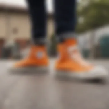 Group of skaters showcasing their orange Converse Chuck Taylors in action