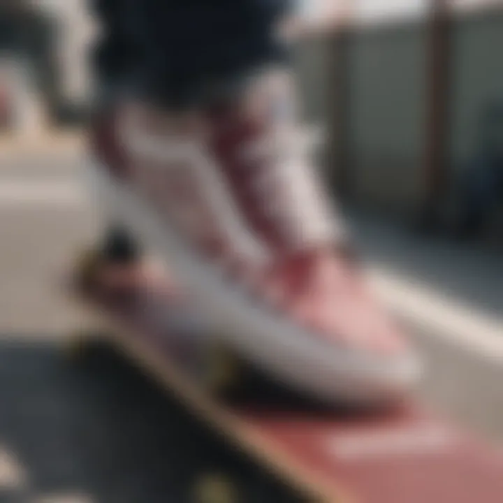 Close-up of maroon and white checkered Vans on a skateboard