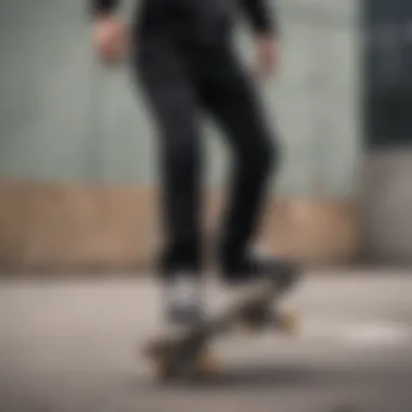 Skateboarder performing tricks in stylish biker black jeans