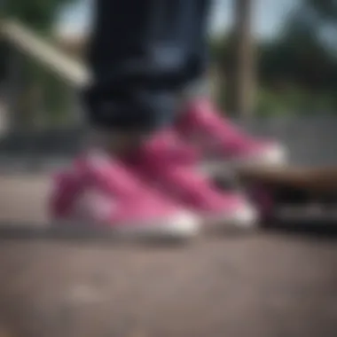 Close-up of Magenta Adidas shoes on a skateboard.