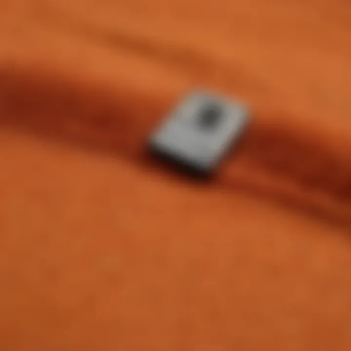 Close-up of the fabric texture of a hunter orange sweatshirt