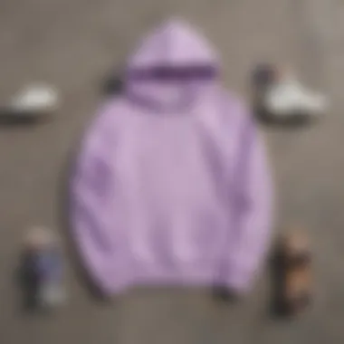 Different styling options for a pastel purple hoodie laid out on a skateboard