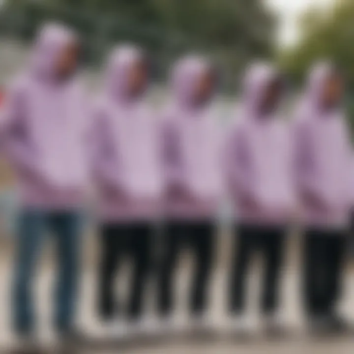 Group of skaters showcasing their pastel purple hoodies at a skate park