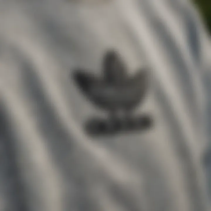 Detailed view of the Adidas crop sweatshirt showcasing its unique stitching and fabric texture.