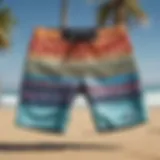 Vibrant long board shorts displayed on a beach backdrop