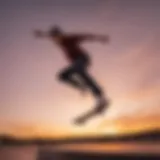 Close-up of a skateboarder performing a trick in mid-air against a vibrant sunset