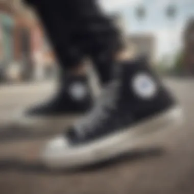 Classic black hi-top Converse shoes showcased against a vibrant urban backdrop