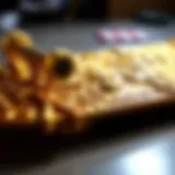 A close-up of an intricately designed gold skateboard showcasing its craftsmanship.