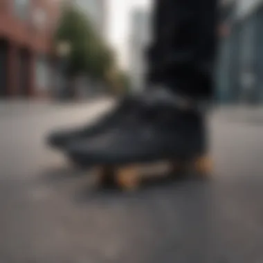 Close-up of black Vans shoes on a skateboard deck