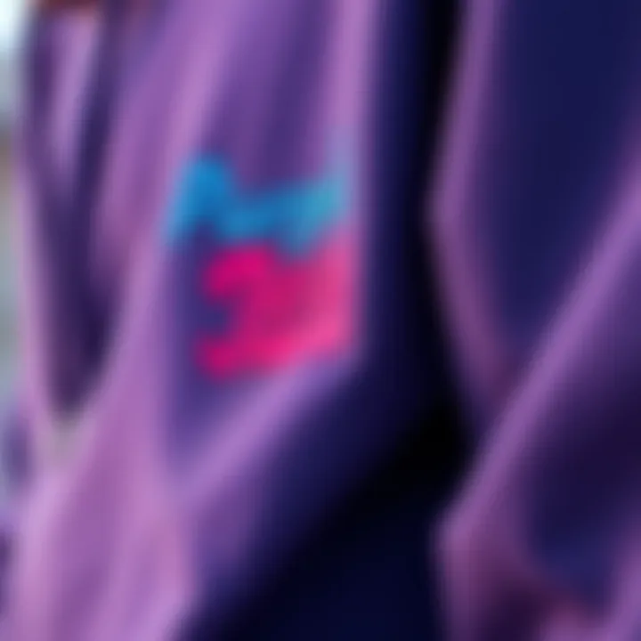 Close-up of a purple jeans hoodie highlighting its fabric and design details.