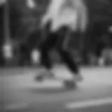 Dynamic skateboarder showcasing black and white Adidas joggers in motion