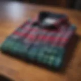 A classic flannel shirt displayed on a wooden table, showcasing vibrant colors and patterns.