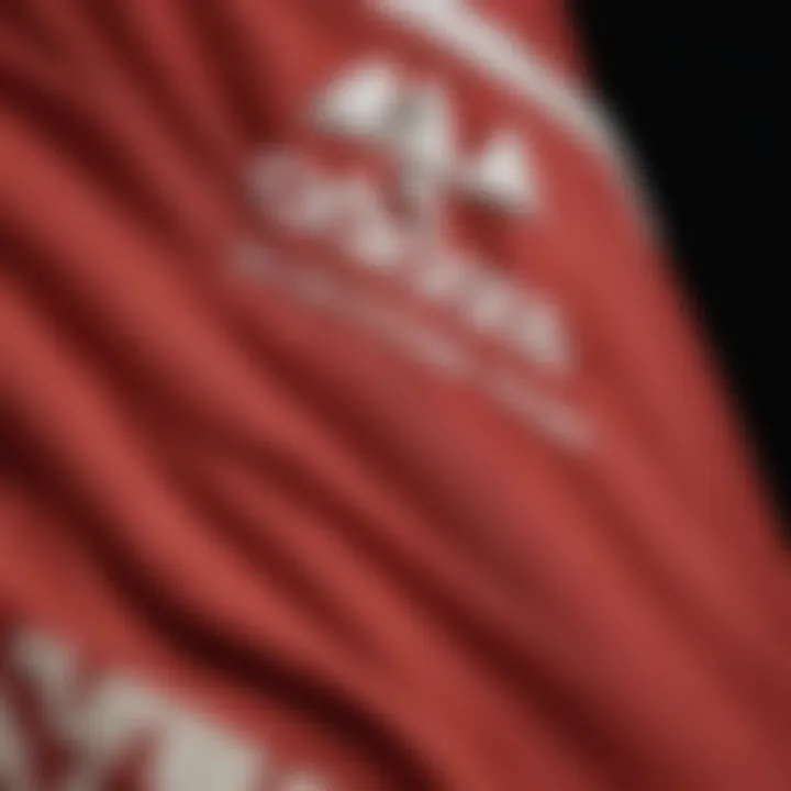 Close-up of red Adidas shorts highlighting the design and branding