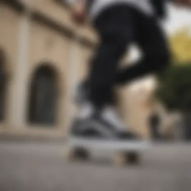 A skateboarder wearing Vans Old Skool Black True White performing a trick.