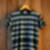 Vintage striped t-shirt displayed on a rustic wooden background
